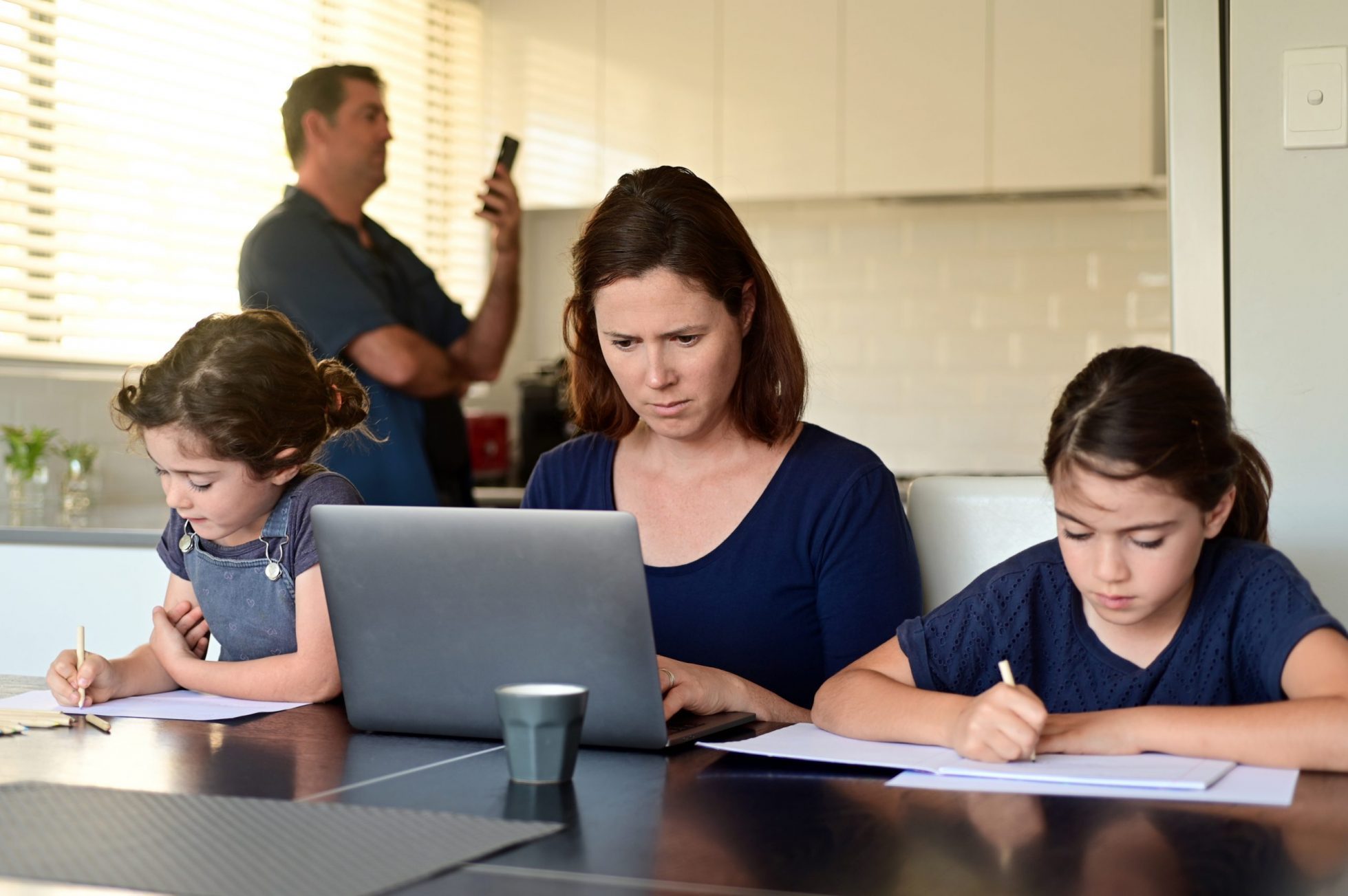 Family at home as the pandemic coronavirus (COVID-19) forces many employees and students to work and study from home. Real people. Copy space